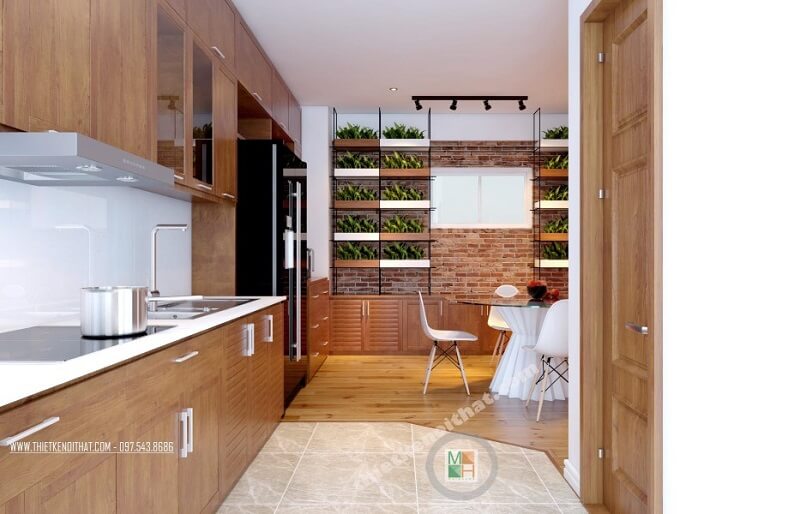 Hệ thống tủ bếp gỗ thiết kế đơn giản, hiện đại kéo dài tạo đô thoáng cho không gian mà vô cùng tiện dụng. Thiết kế chung cư