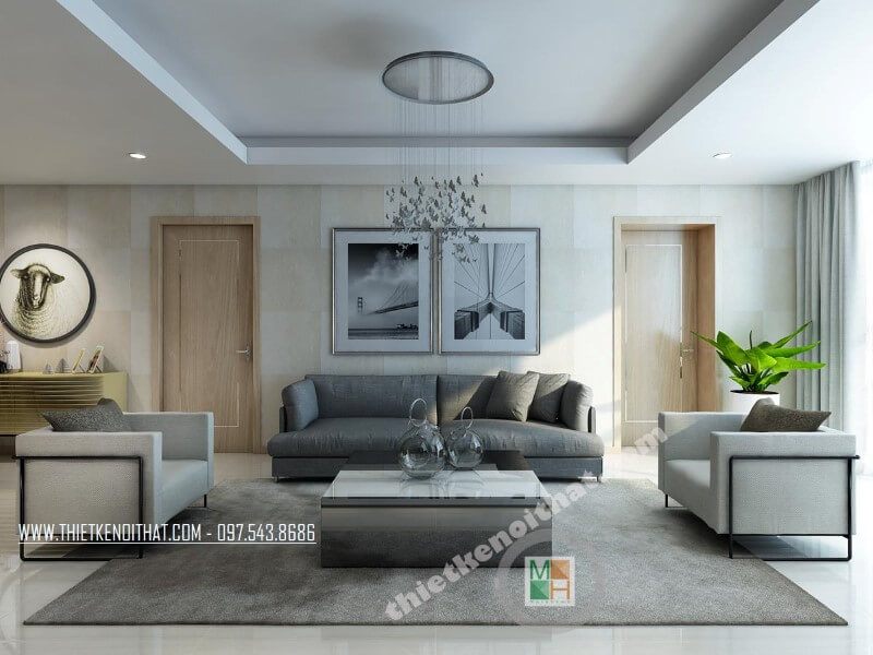 Mẫu thiết kế phòng khách chung cư sang trọng với bộ sofa bọc vài màu xám và trắng tạo điểm nhấn nổi bật cho căn phòng.
